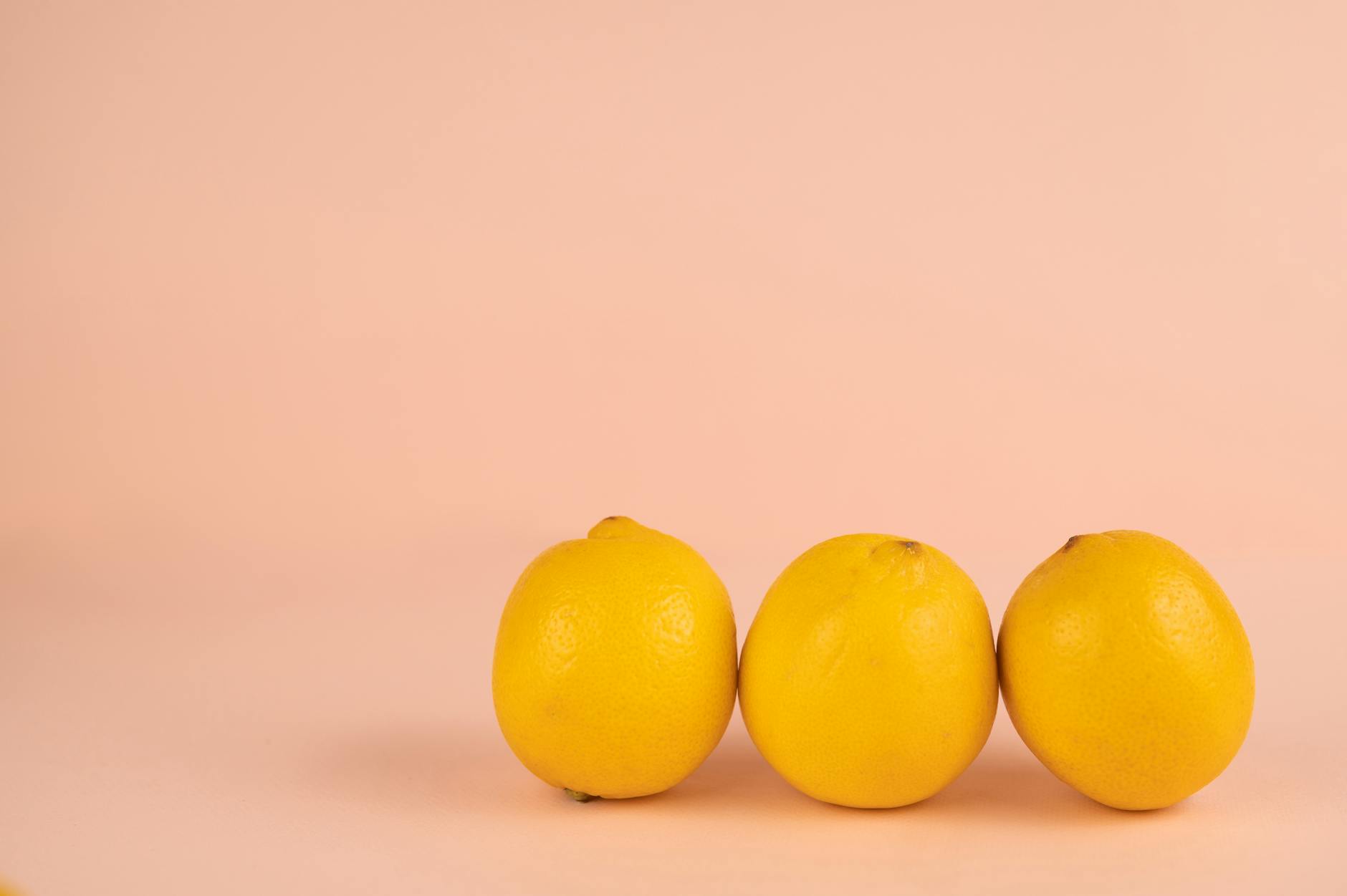 Bright ripe lemons on a pastel background symbolizing freshness and citrus appeal
